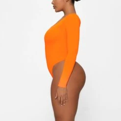 ESSENTIAL LONG SLEEVE SCOOP NECK BODYSUIT | ORANGE HIGHLIGHTER -Deals Easy Allure Wardrobe Store SKIMS BODYSUIT BS SCN 0315 GA ORH 0007 SD