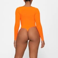 ESSENTIAL LONG SLEEVE SCOOP NECK BODYSUIT | ORANGE HIGHLIGHTER -Deals Easy Allure Wardrobe Store SKIMS BODYSUIT BS SCN 0315 GA ORH 0012 BK