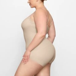 FITS EVERYBODY CORDED LACE ONESIE | SAND -Deals Easy Allure Wardrobe Store SKIMS LOUNGEWEAR OS MDT 4131 FC SND 0010 SD x2 59630ace 04d8 4a13 94fd 02c7548bffa0